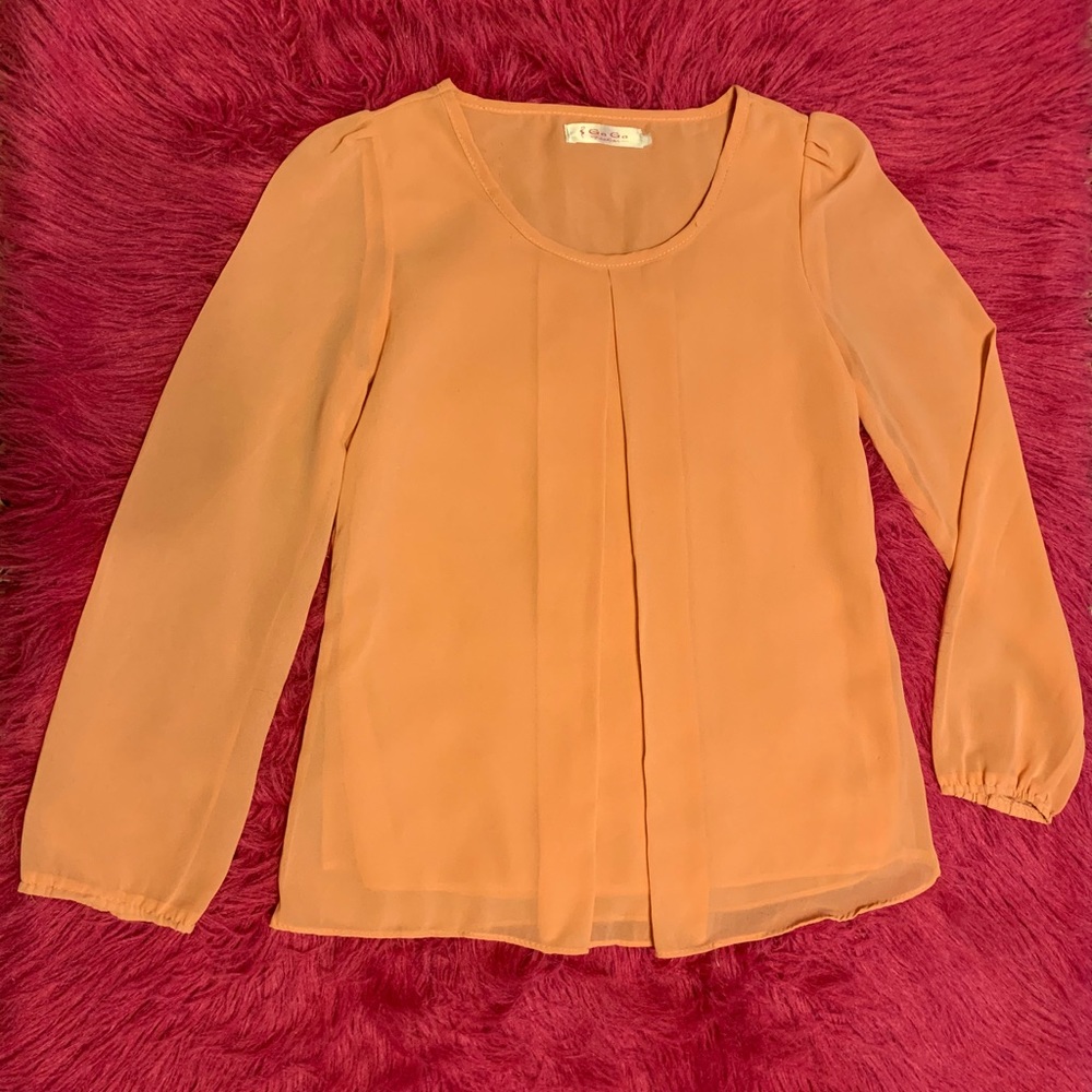 A peach blouse